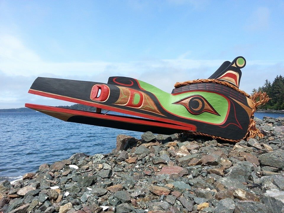 Long-beaked Hokhok mask resting on shoreline rocks