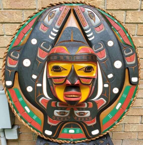 Restored sun mask round panel with vivid paint